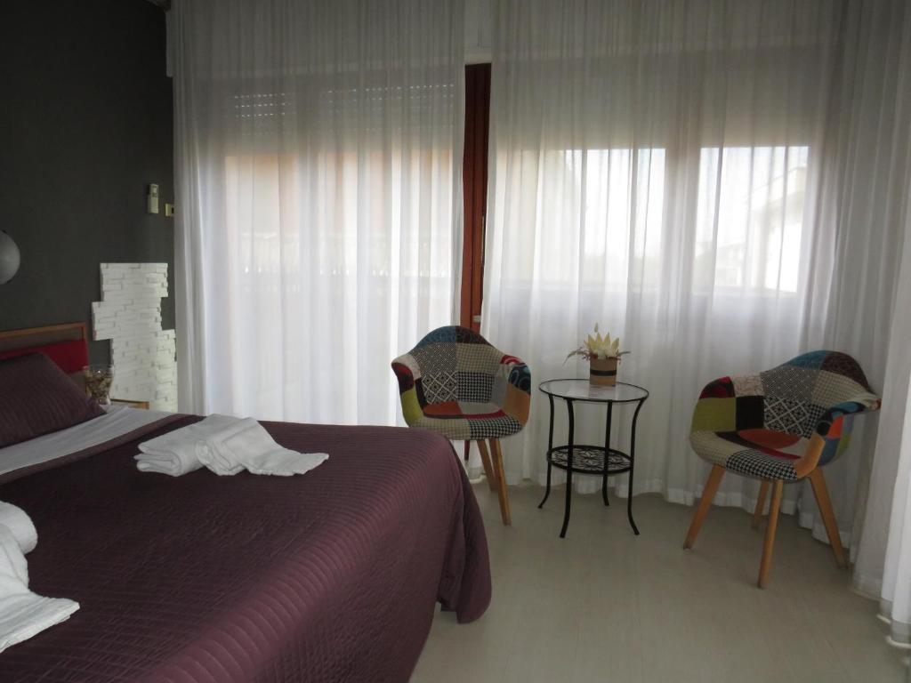 Postel nebo postele na pokoji v ubytování Hotel San Michele