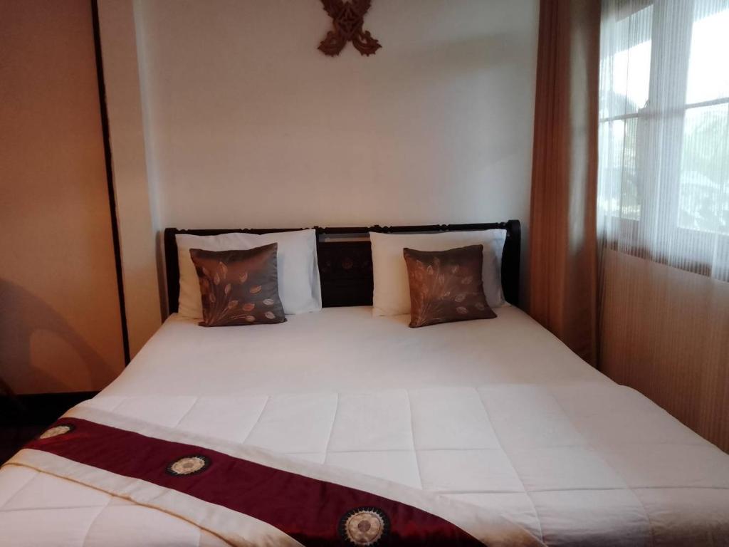 Postel nebo postele na pokoji v ubytování Naturbliss Resort Village