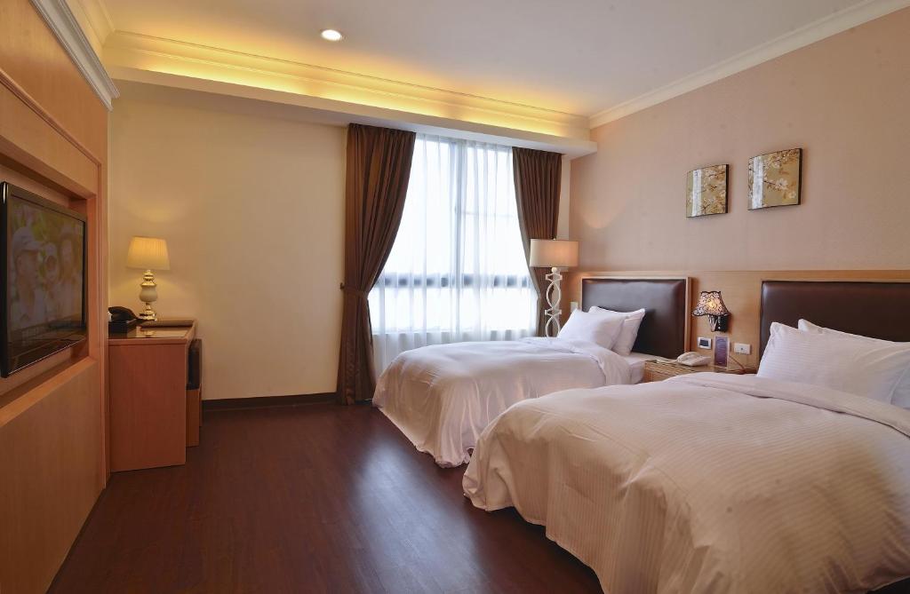 Postel nebo postele na pokoji v ubytování Hotel Modern Puli