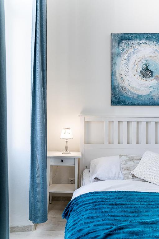 A bed or beds in a room at Center Apartment Mlynska Kosice with private Parking