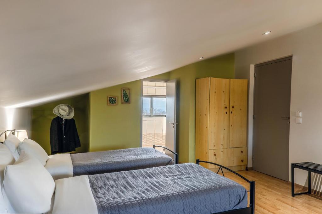 Postel nebo postele na pokoji v ubytování Jo Marinis Rooms