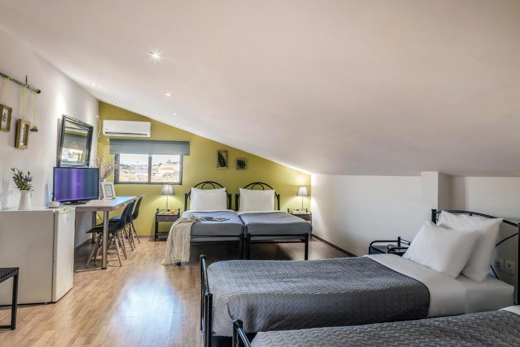 Postel nebo postele na pokoji v ubytování Jo Marinis Rooms