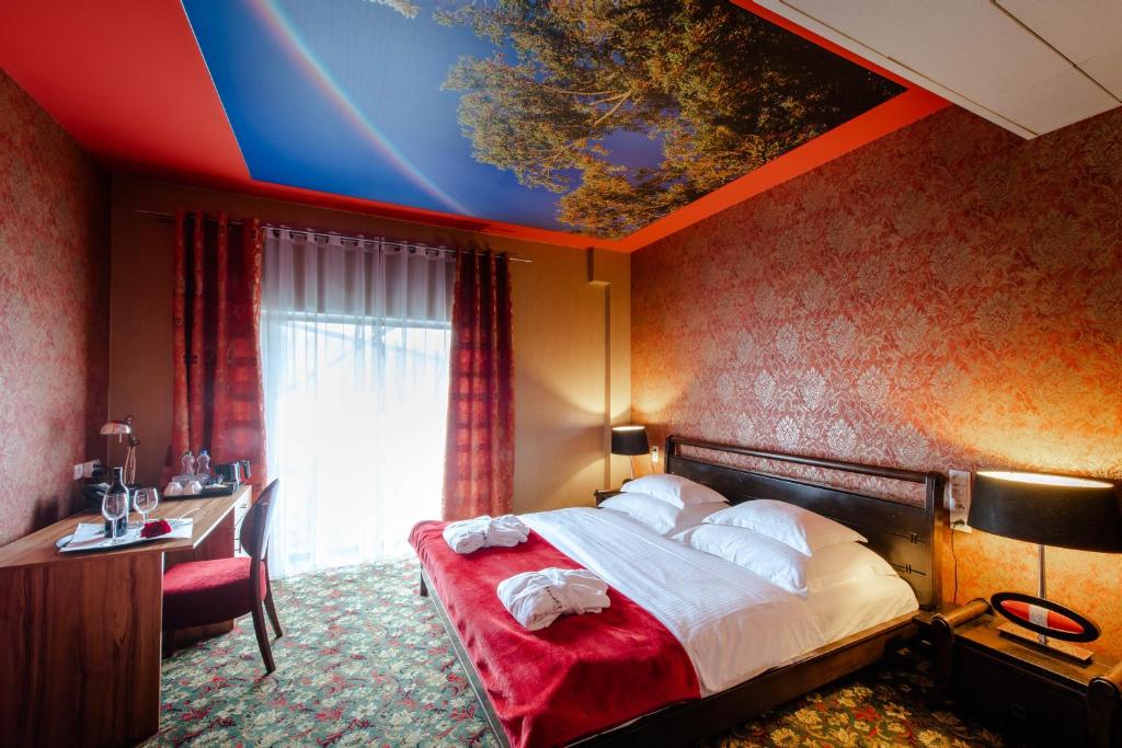 Posteľ alebo postele v izbe v ubytovaní Hotel Lenart