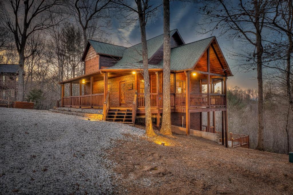 a large wooden house in the woods at night at Cozy Blue Ridge Cabin in Heart of the Mountains in Blue Ridge
