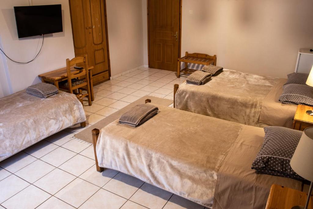 Postel nebo postele na pokoji v ubytování Hotel Defkalion