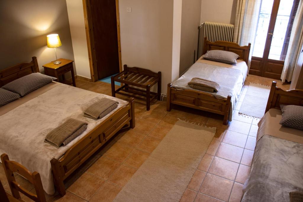 Postel nebo postele na pokoji v ubytování Hotel Defkalion