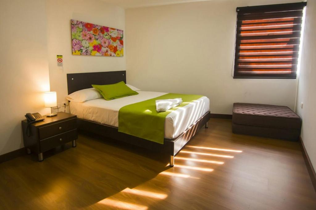 Postel nebo postele na pokoji v ubytování Hotel Valle de San Nicolas
