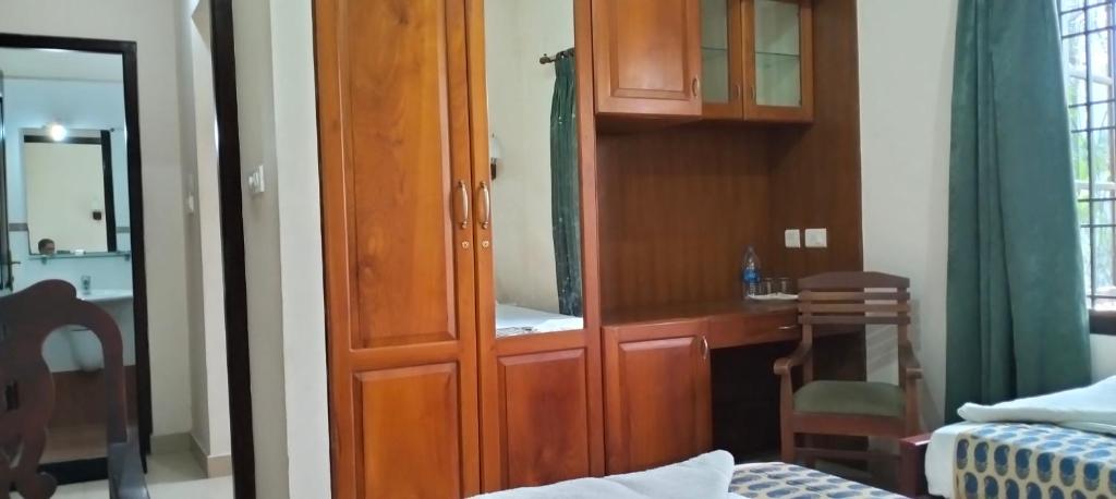 Postel nebo postele na pokoji v ubytování Elim Homestay Fort Kochi