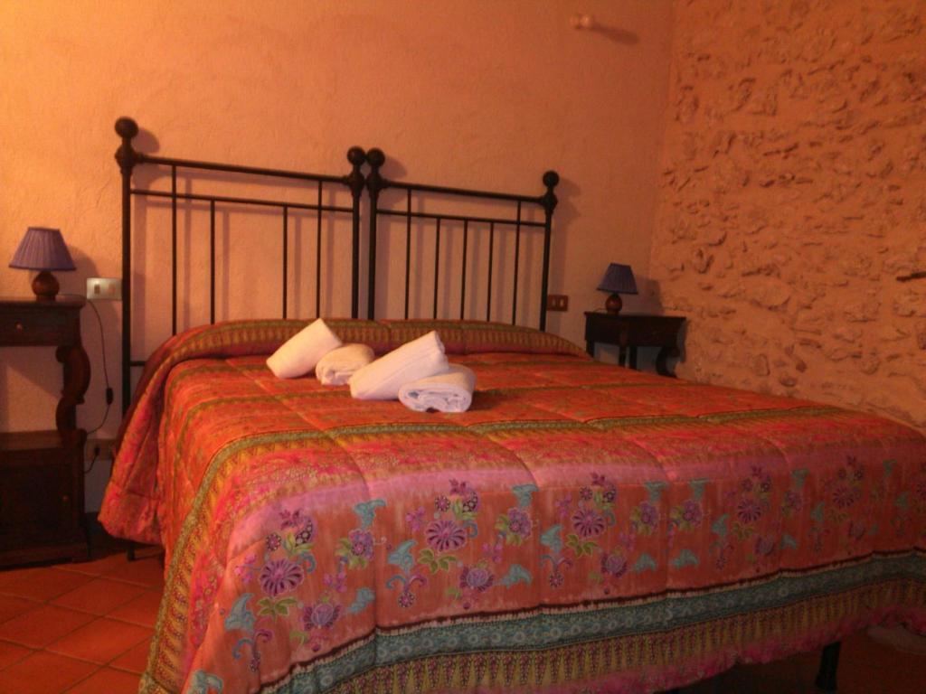 Łóżko lub łóżka w pokoju w obiekcie La Casa Sù Le Dimore Del Borgo
