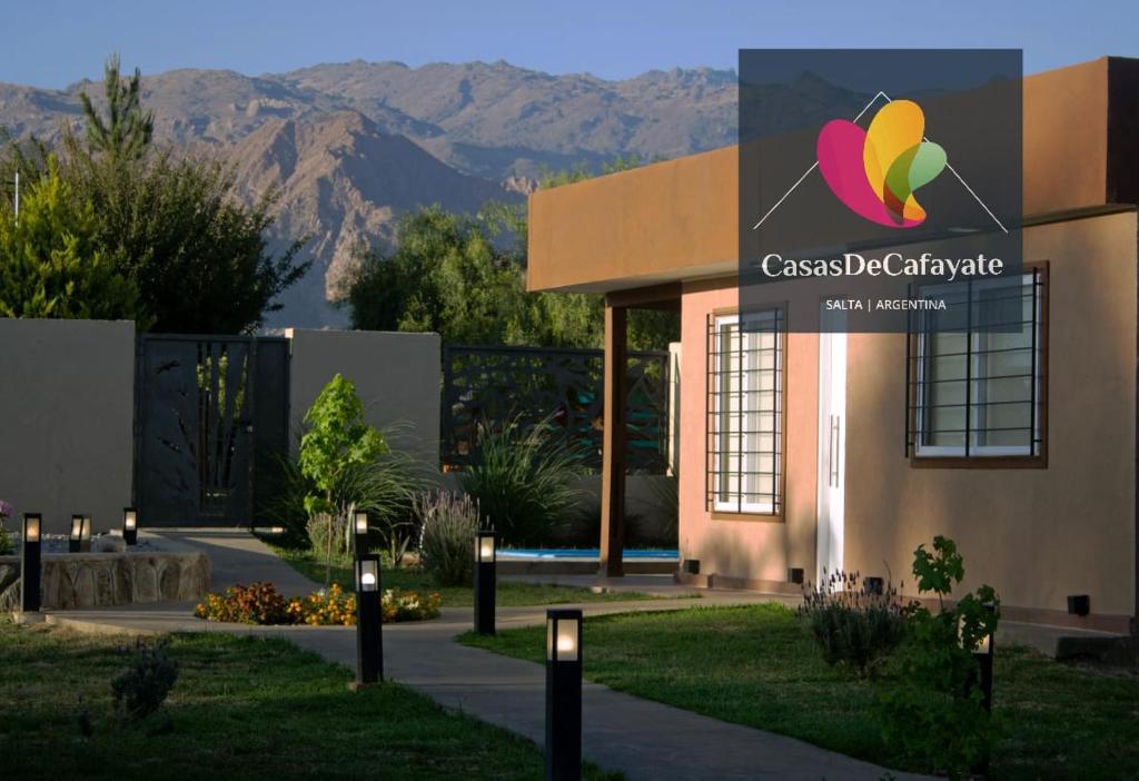 a building with a sign on the side of it at Casas de Cafayate in Cafayate