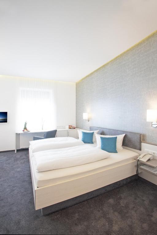 Postel nebo postele na pokoji v ubytování Ebner - Boutique-Hotel & Konditorei