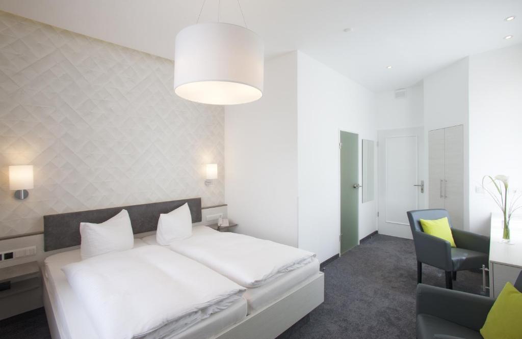 Postel nebo postele na pokoji v ubytování Ebner - Boutique-Hotel & Konditorei