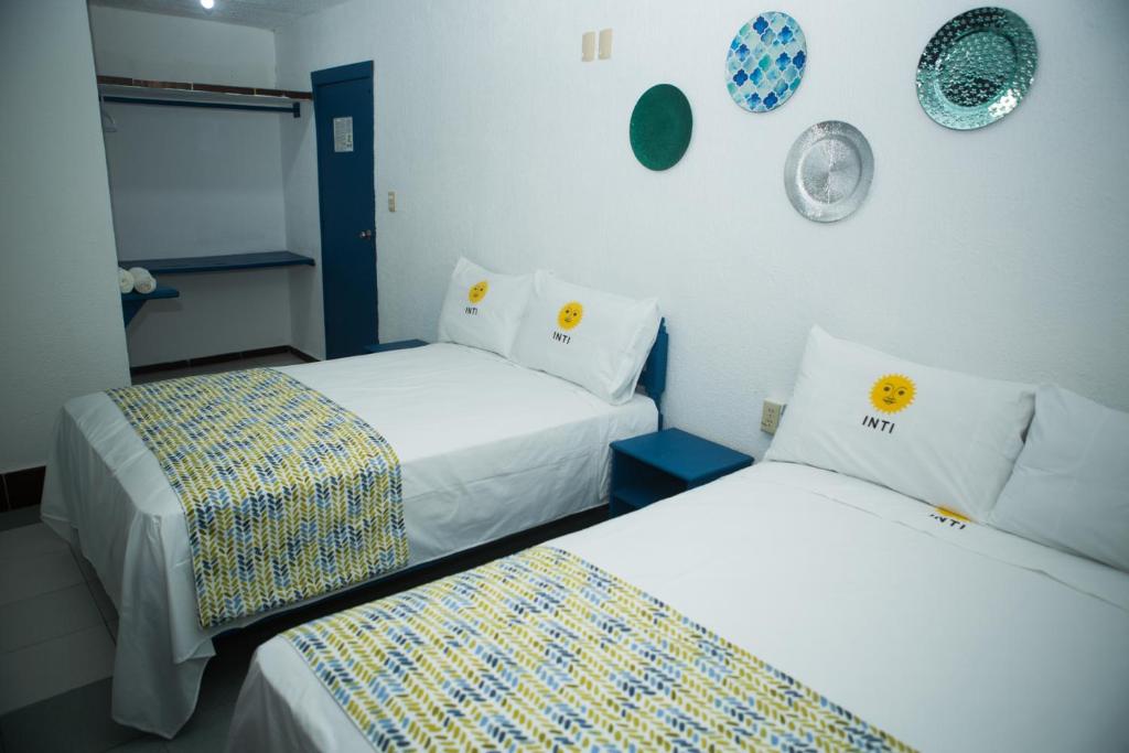 Postel nebo postele na pokoji v ubytování HOTEL INTI