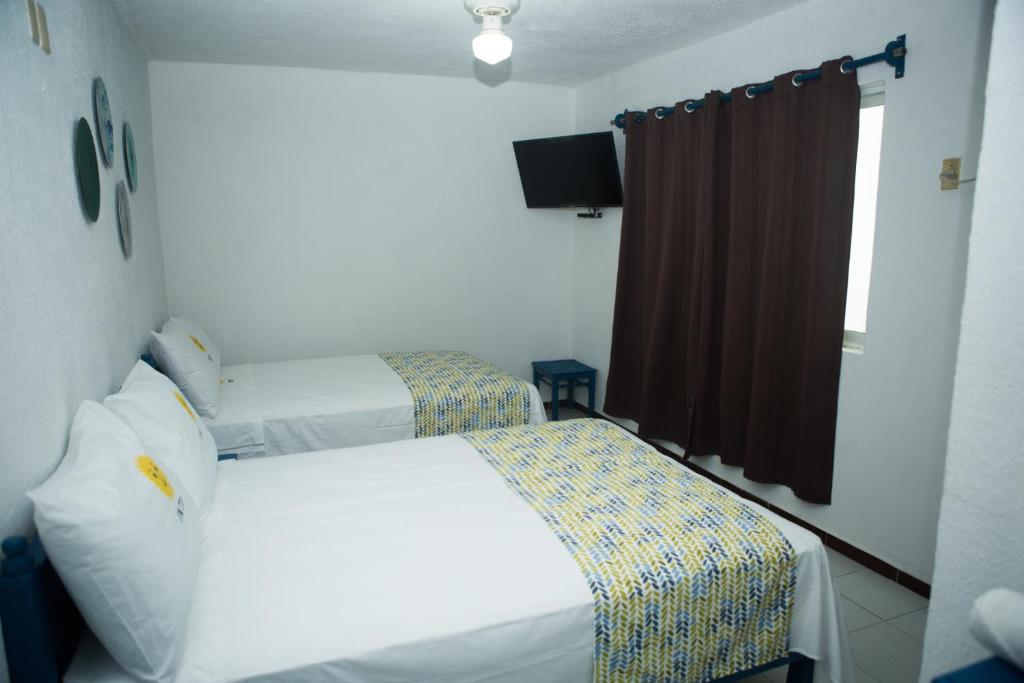 Postel nebo postele na pokoji v ubytování HOTEL INTI