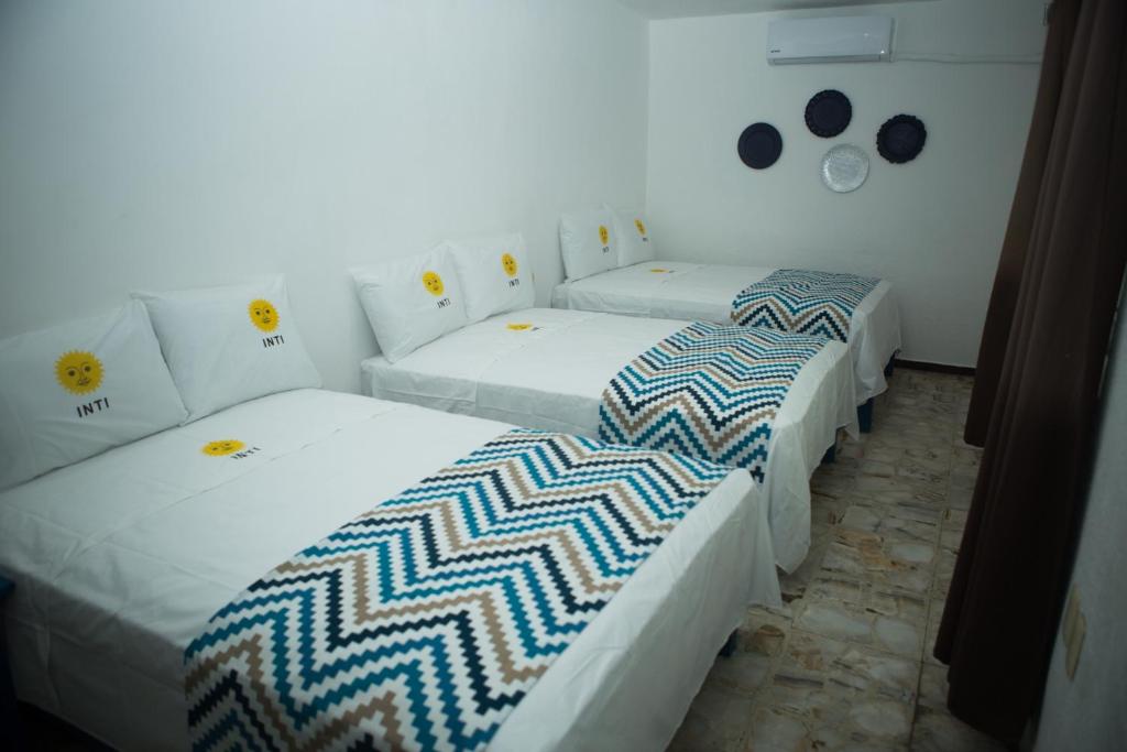Postel nebo postele na pokoji v ubytování HOTEL INTI