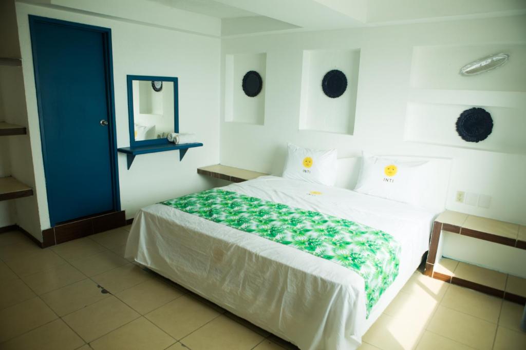 Postel nebo postele na pokoji v ubytování HOTEL INTI