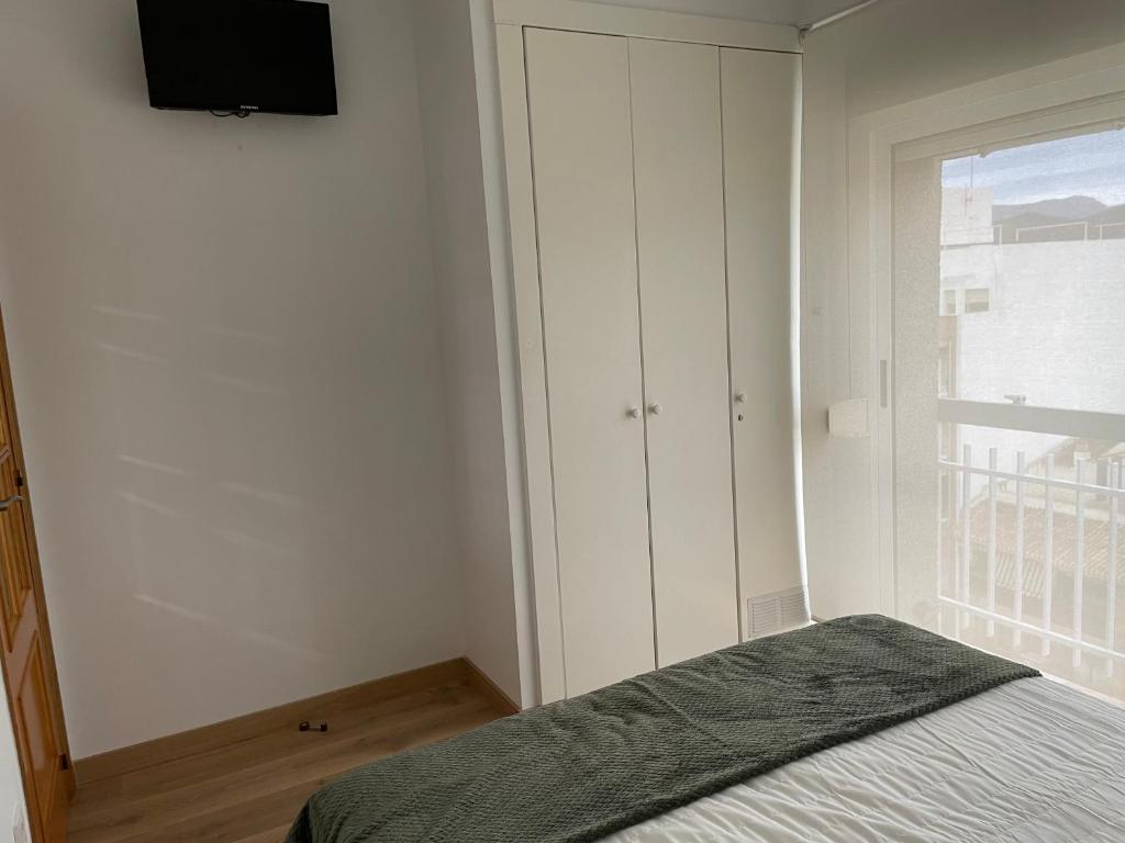 Postel nebo postele na pokoji v ubytování Bonefish 2 Apartment