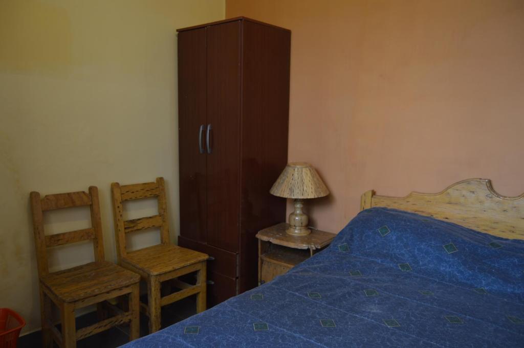 Hostal Coronel Pedro Arraya客房内的一张或多张床位