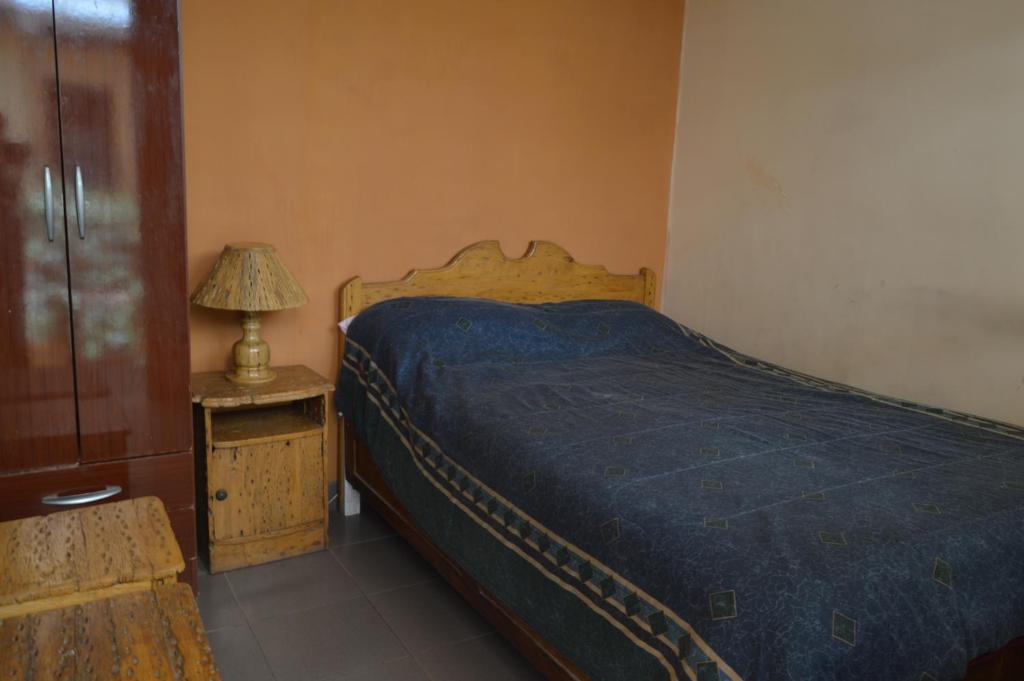 Hostal Coronel Pedro Arraya客房内的一张或多张床位