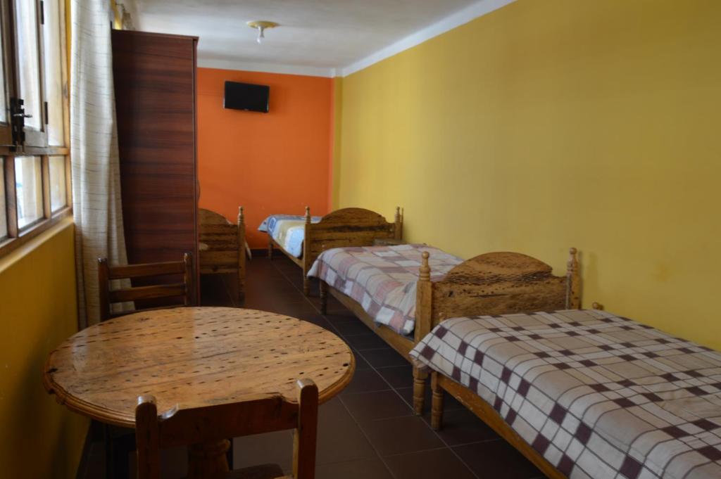 Hostal Coronel Pedro Arraya客房内的一张或多张床位