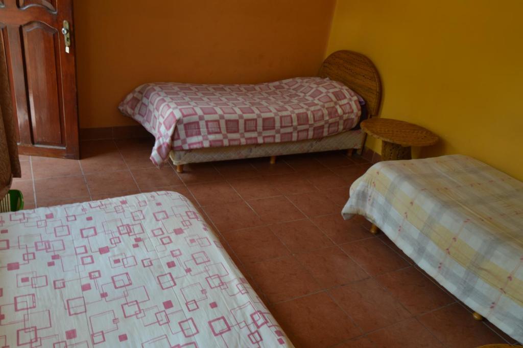 Hostal Coronel Pedro Arraya客房内的一张或多张床位