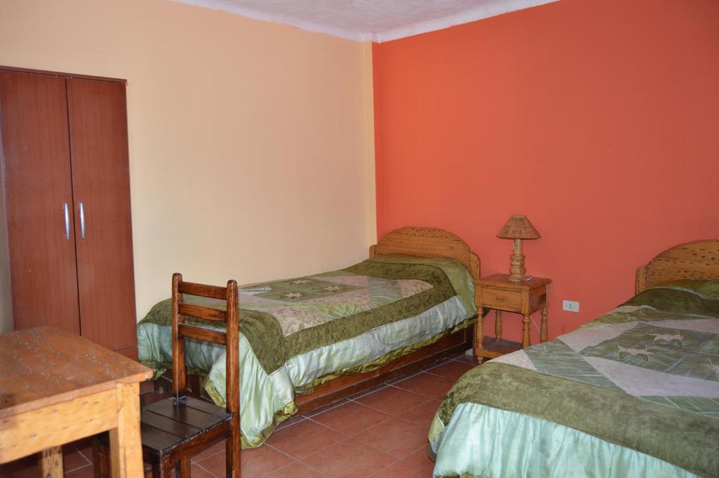 Hostal Coronel Pedro Arraya客房内的一张或多张床位