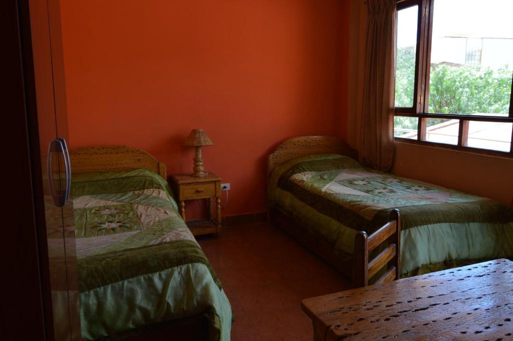 Hostal Coronel Pedro Arraya客房内的一张或多张床位