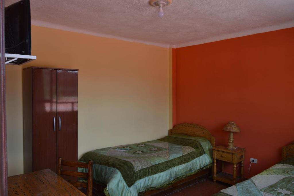 Hostal Coronel Pedro Arraya客房内的一张或多张床位