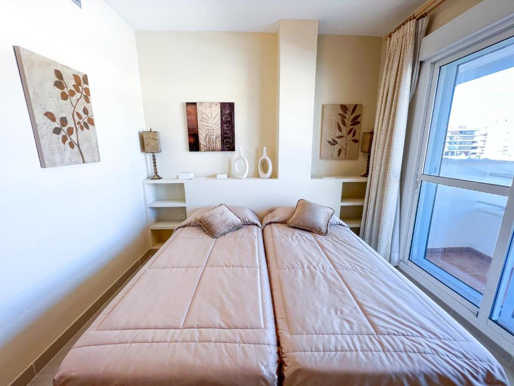 Postel nebo postele na pokoji v ubytování Apartamento acogedor de 2 dormitorios a solo 150 m de la playa Sabinillas, Manilva
