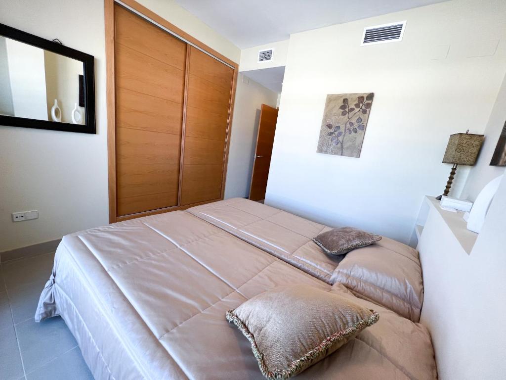 Postel nebo postele na pokoji v ubytování Apartamento acogedor de 2 dormitorios a solo 150 m de la playa Sabinillas, Manilva