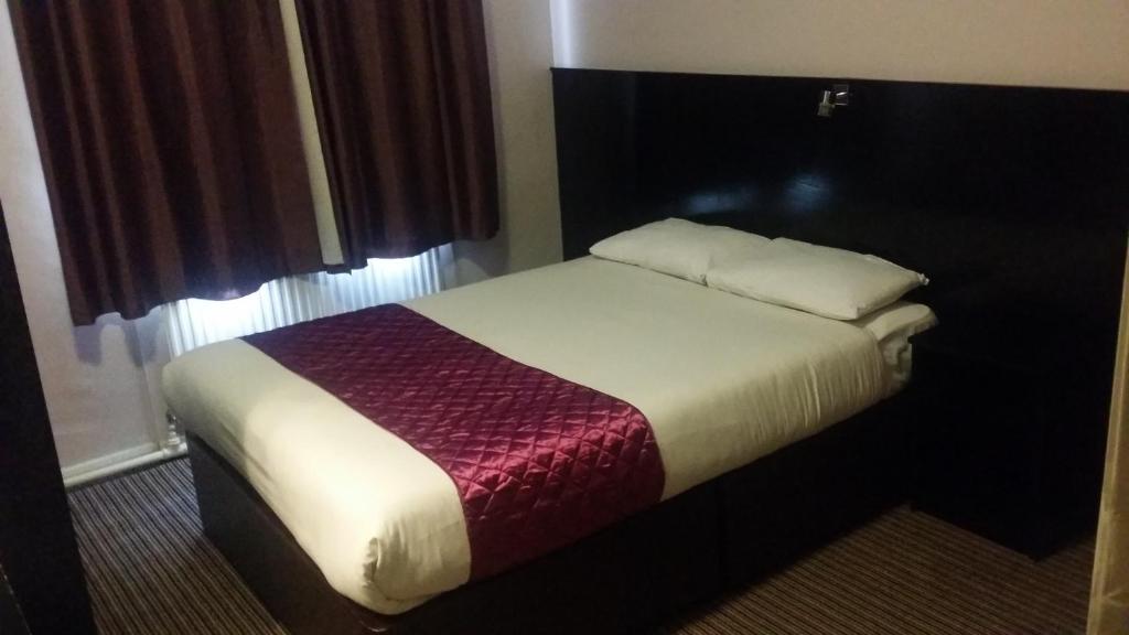 Postel nebo postele na pokoji v ubytování Arriva Hotel