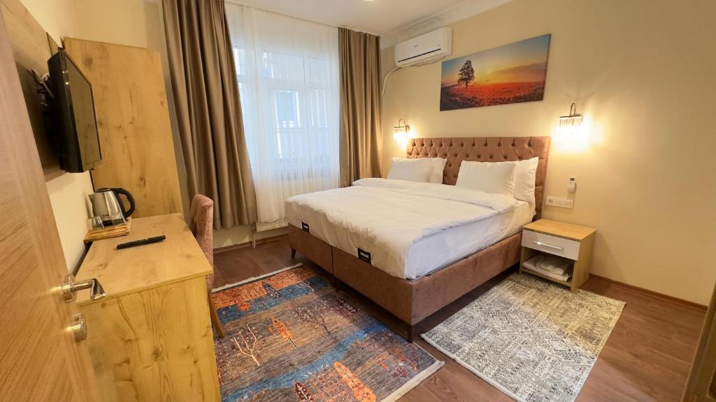 Un pat sau paturi într-o cameră la Albatros Apart Suite