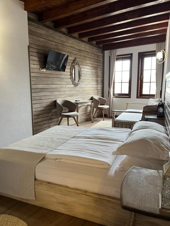 Postel nebo postele na pokoji v ubytování Manoleva House