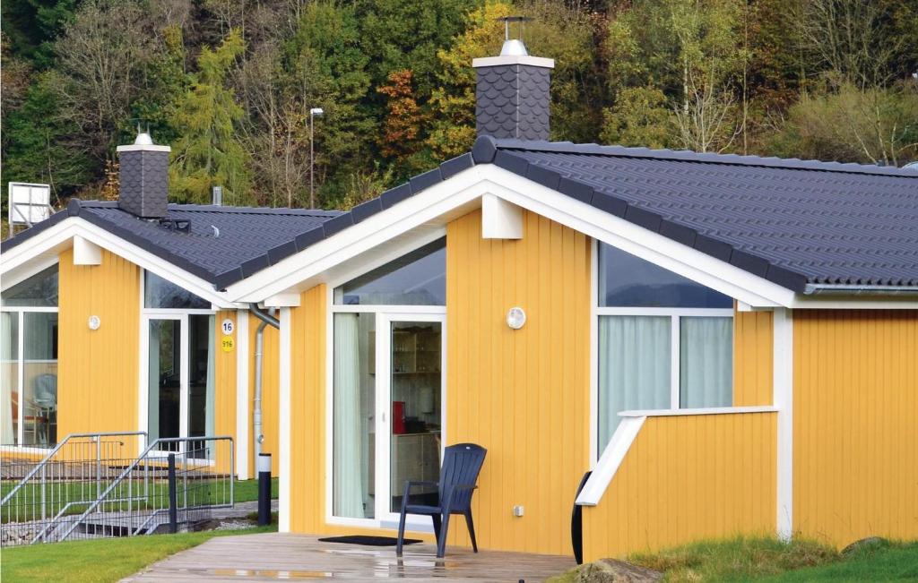 a yellow house with a black roof at St, Andreasberg, Haus 14 in Sankt Andreasberg