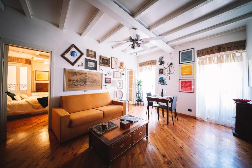 a living room with a couch and a table at DUOMO - The Warm Maison - EXCLUSIVE in Milan