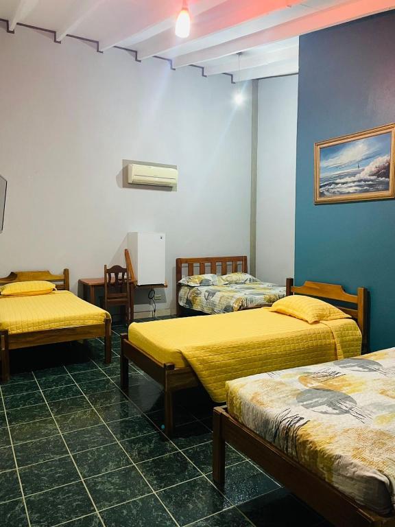 Postel nebo postele na pokoji v ubytování Hotel El Chaman