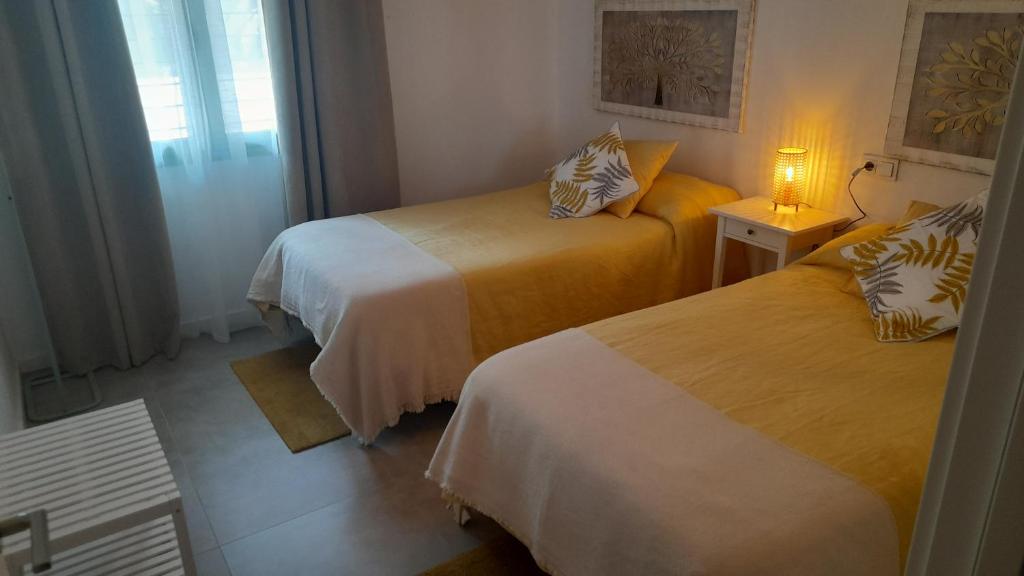 Postel nebo postele na pokoji v ubytování Apartamento El Sueño Mojácar 1ª Línea de playa