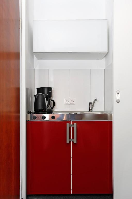 Kuchyň nebo kuchyňský kout v ubytování Hotel Apartment Laforsch