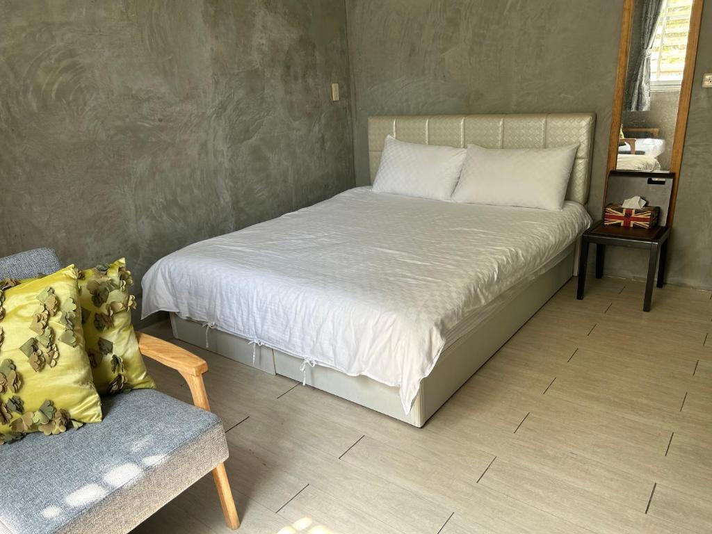 A bed or beds in a room at Lucky Taitung