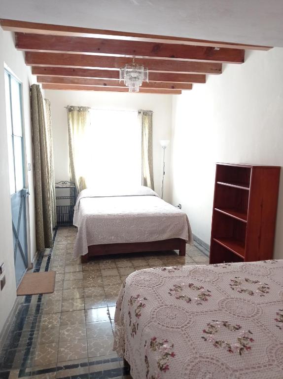 Postel nebo postele na pokoji v ubytování Posada Antiguo Camino Real