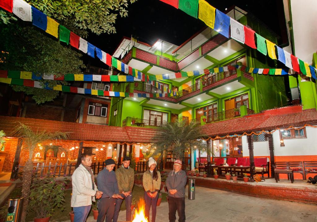 a group of people standing in front of a building at Hotel Green Horizon in Kathmandu