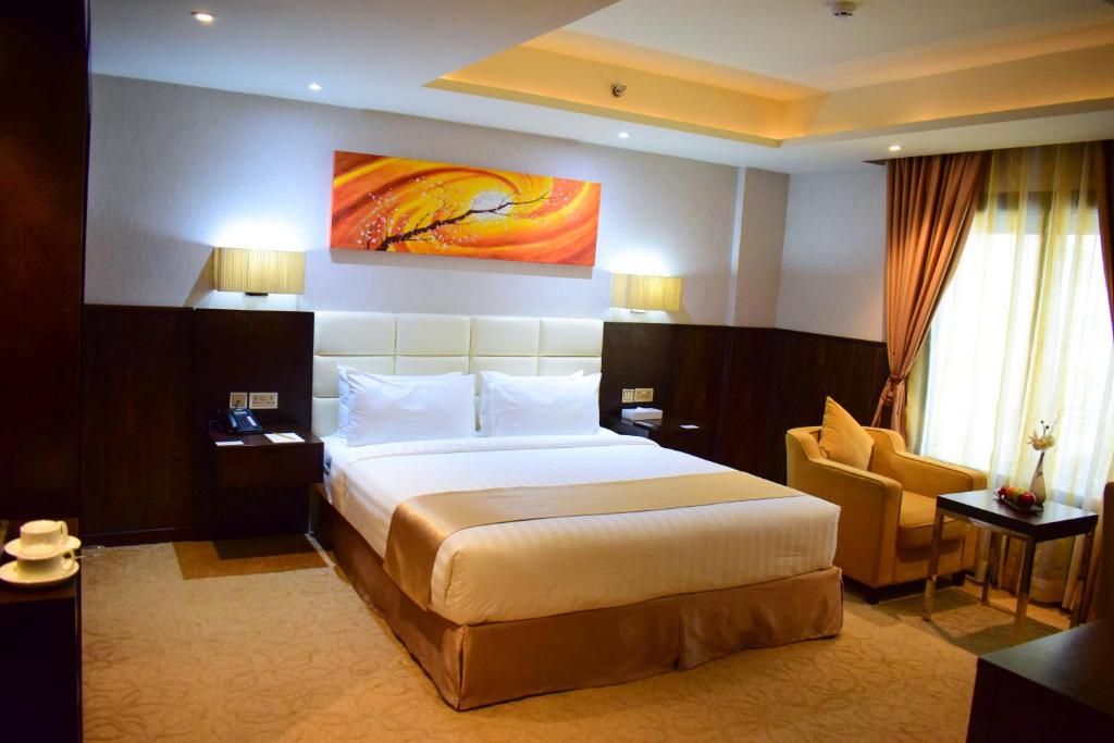 Postel nebo postele na pokoji v ubytování The Secure Inn Hotel Muscat
