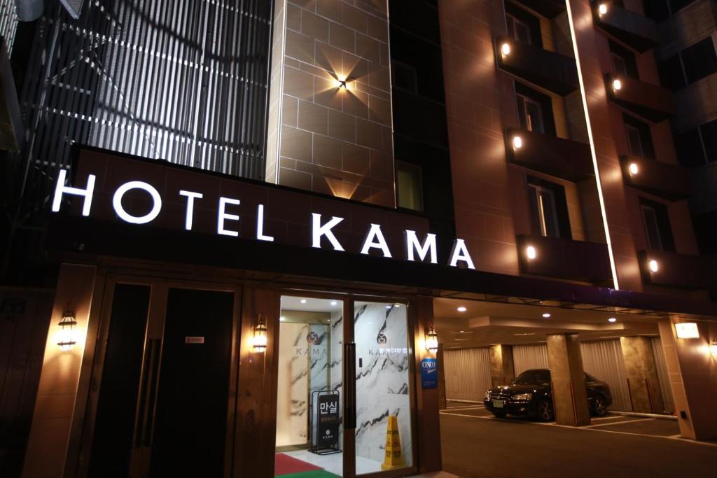 a hotel karma sign on the front of a building at KAMA Hotel in Jeonju