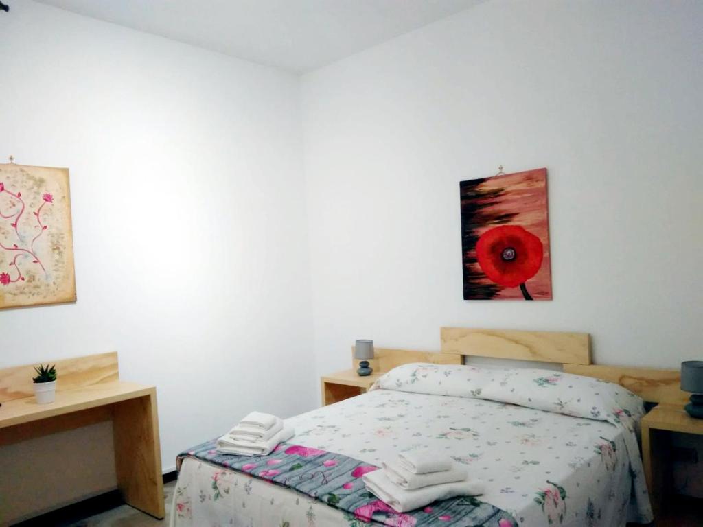 A bed or beds in a room at Casa Blasco Porto Cesareo