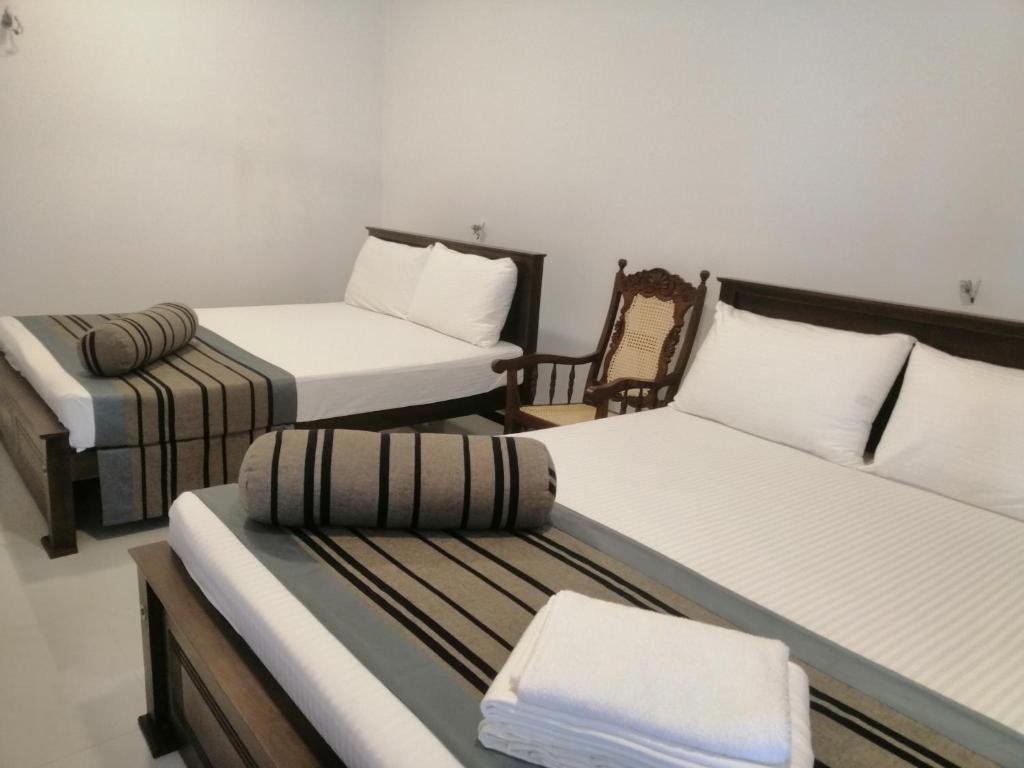 Postel nebo postele na pokoji v ubytování Golden Residence