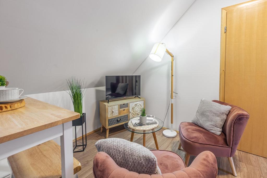 Televízia a/alebo spoločenská miestnosť v ubytovaní Stone apartment in Center