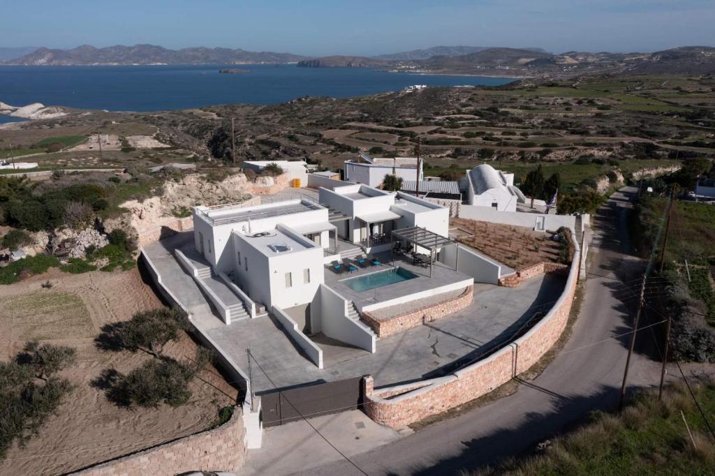 an aerial view of a large white house at Thiopetra Villas in Triovasálos