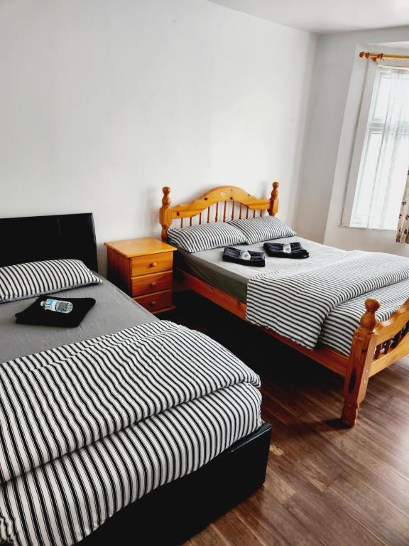 Ένα ή περισσότερα κρεβάτια σε δωμάτιο στο Affordable Private Rooms in Wembley