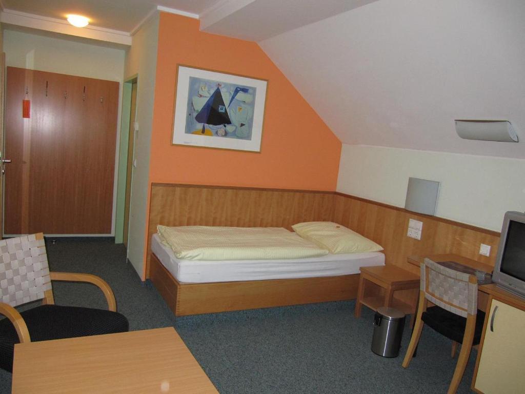 Postel nebo postele na pokoji v ubytování Austrian Sports Resort, BSFZ Obertraun