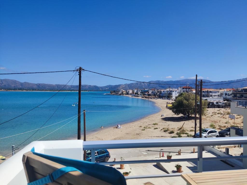 a view of a beach from a balcony at Theros - Bahia in Elafonisos